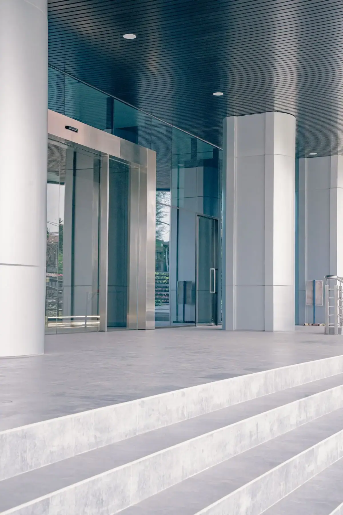 Glass entrance of a Costa Mesa office building