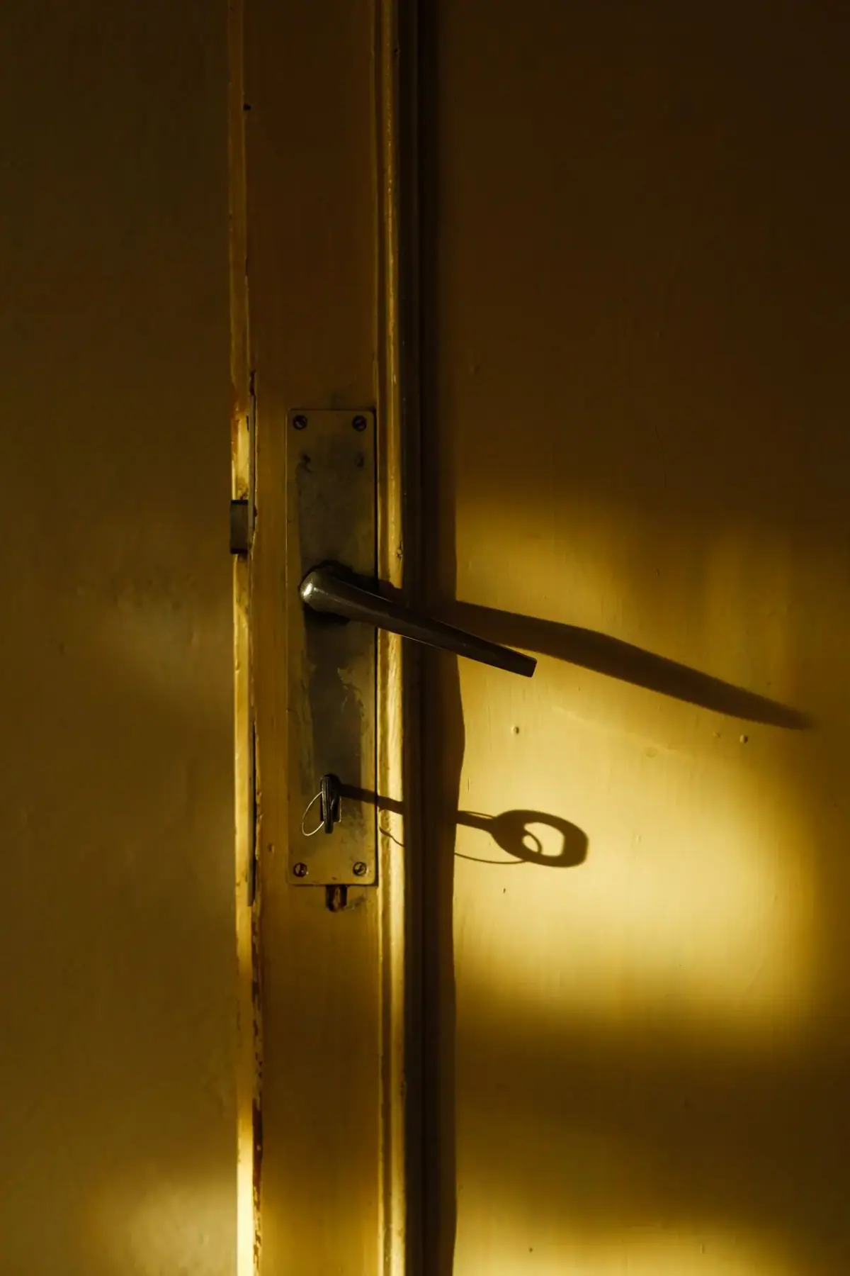 Door with a fitted lock in warm light, deadbolt installation in Costa Mesa