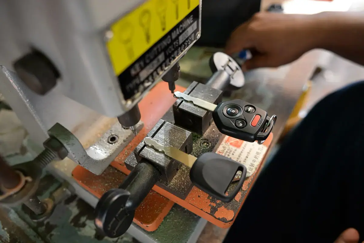 Keys being cut on a professional key cutting machine in Costa Mesa