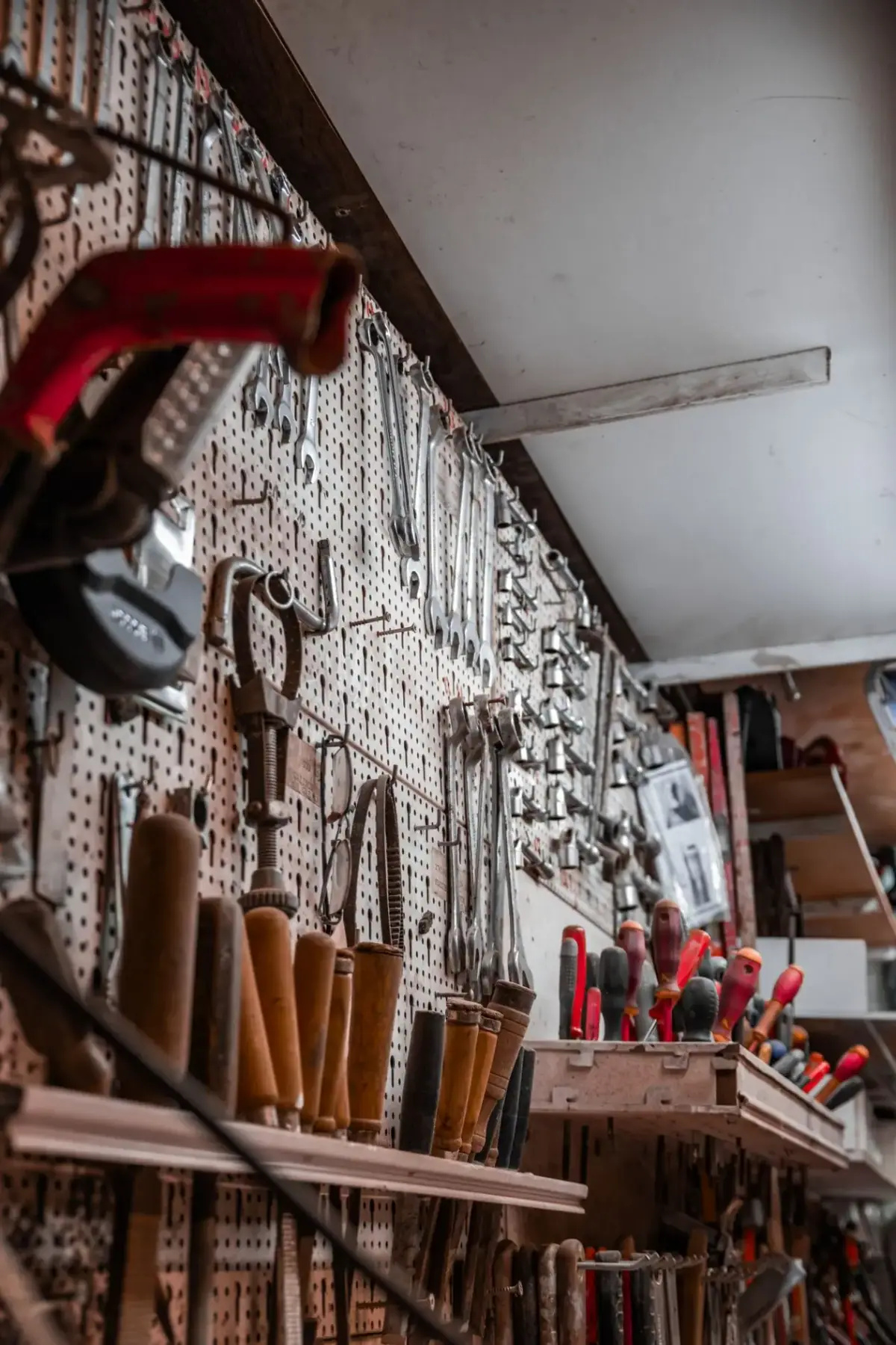 Locksmith tools on a workshop pegboard in Costa Mesa